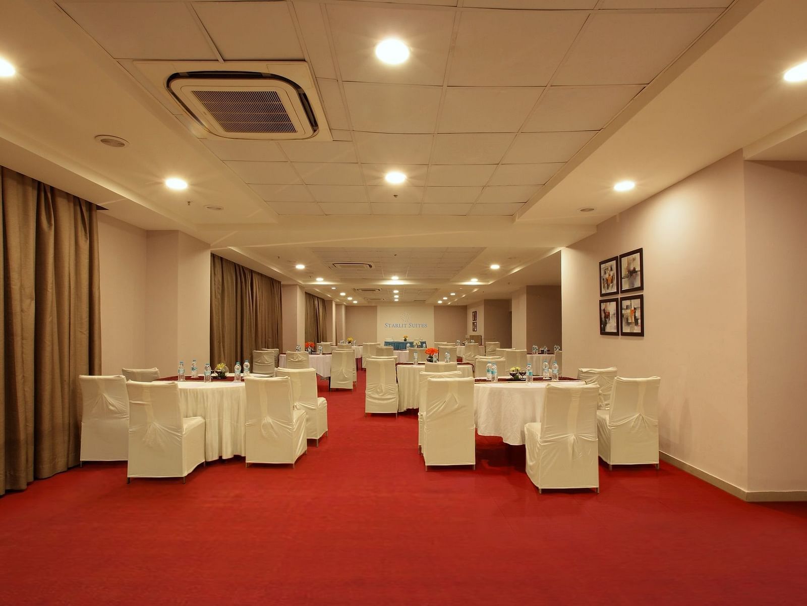 Seating arrangement in the banquet hall at Starlit Suites, Bangalore