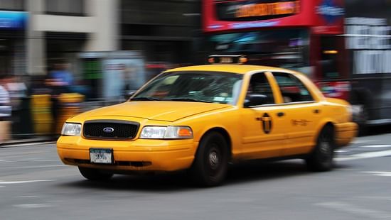 selective-focus-photography-of-yellow-sedan-1310781
