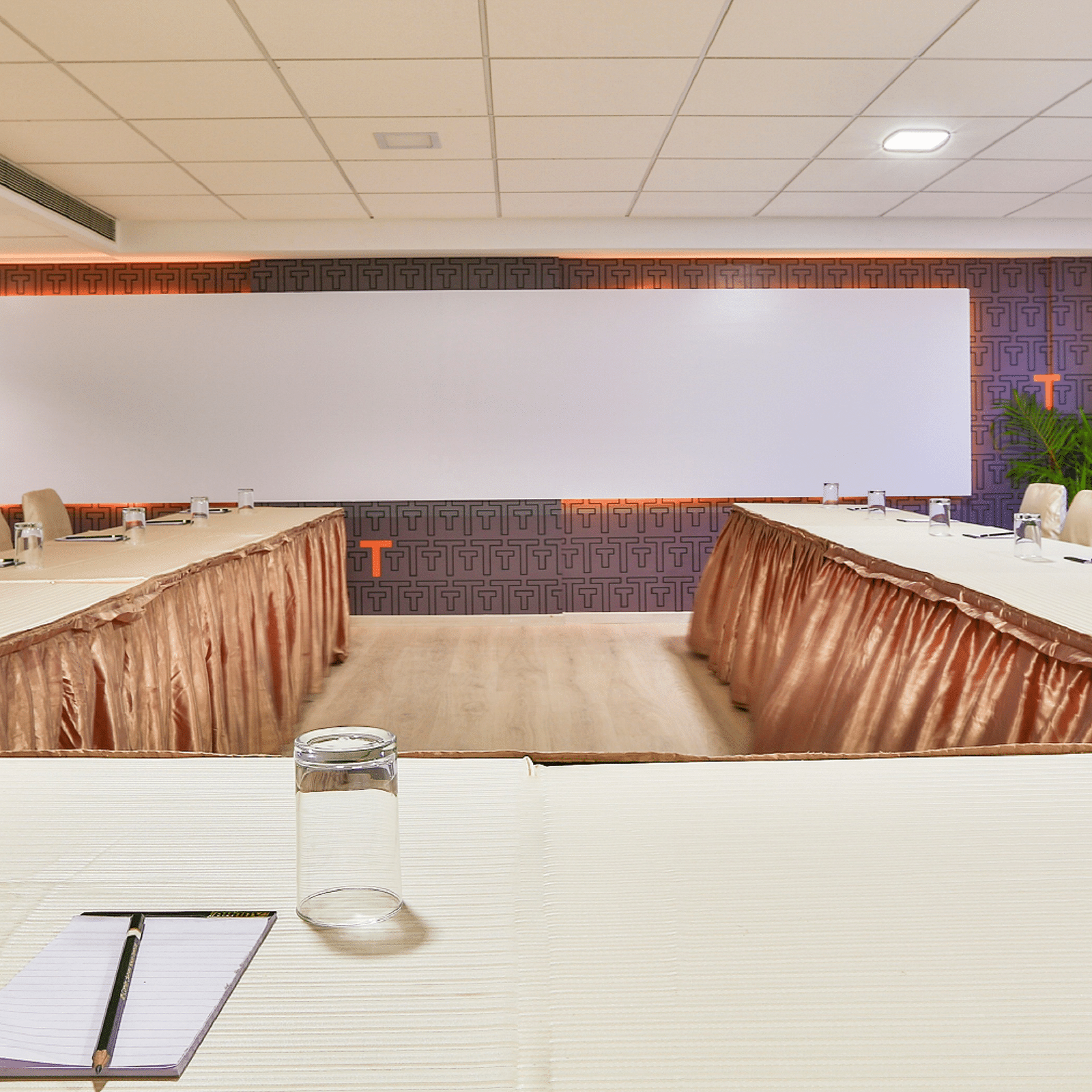 U-shaped seating arrangement with a projector set-up in the event space at T24 Residency, Andheri East, Mumbai