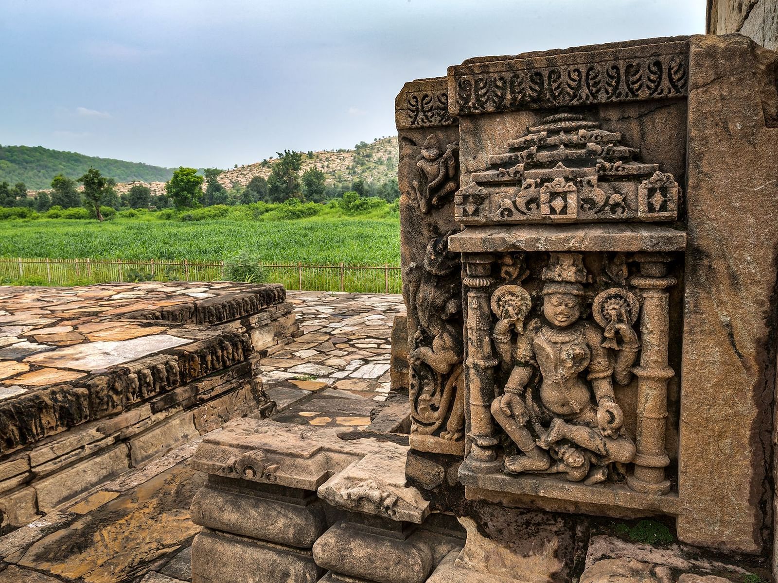 An image of beautiful carvings of gods on the walls of Neelkanth Temple