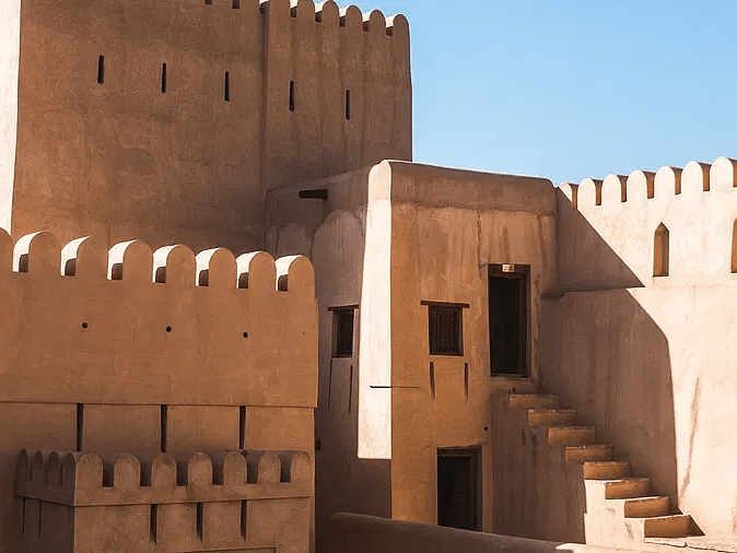 A fortified building with high walls and towers.