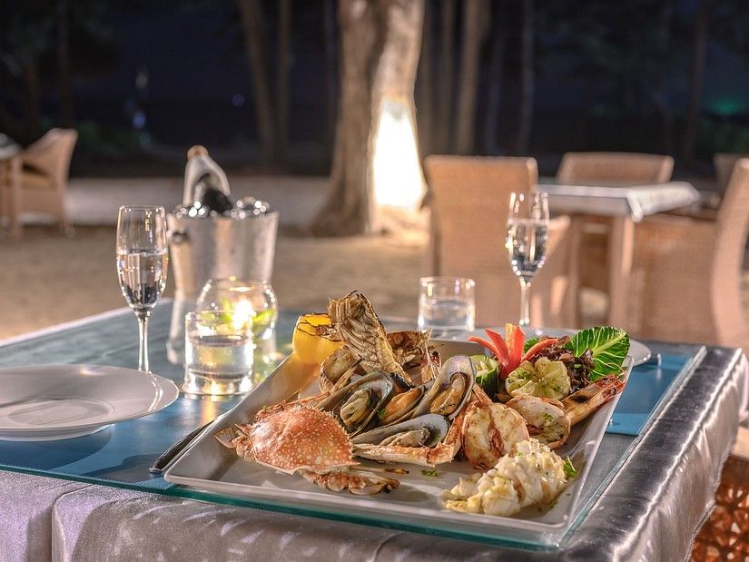 a close up image of the assorted seafood platter featuring crabs, oysters and scallops - Maikhao Dream Villa Resort & Spa, Phuket