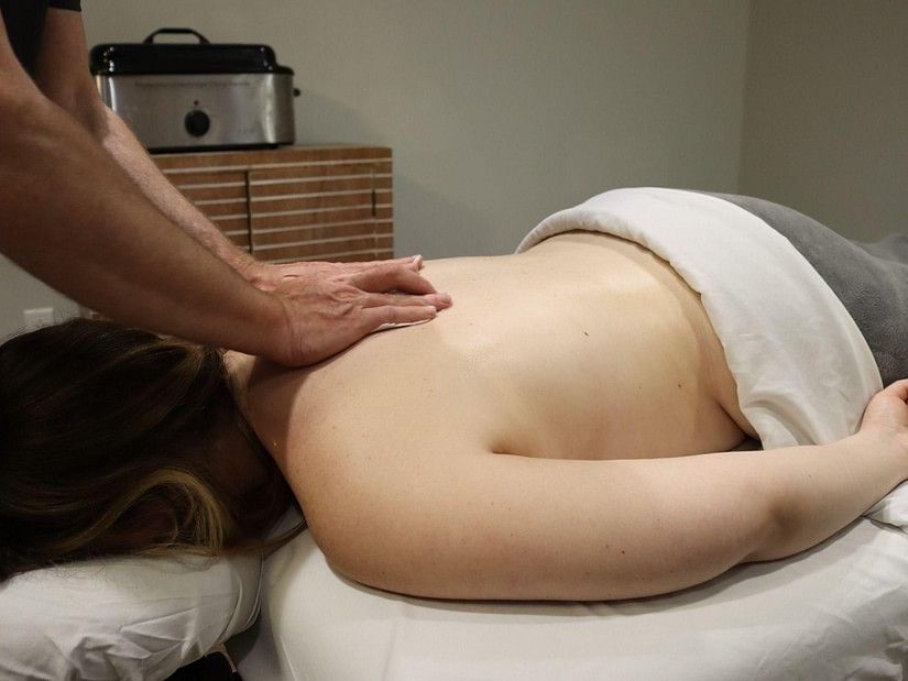 The back of a woman receiving deep tissue massage at YO1  health resorts