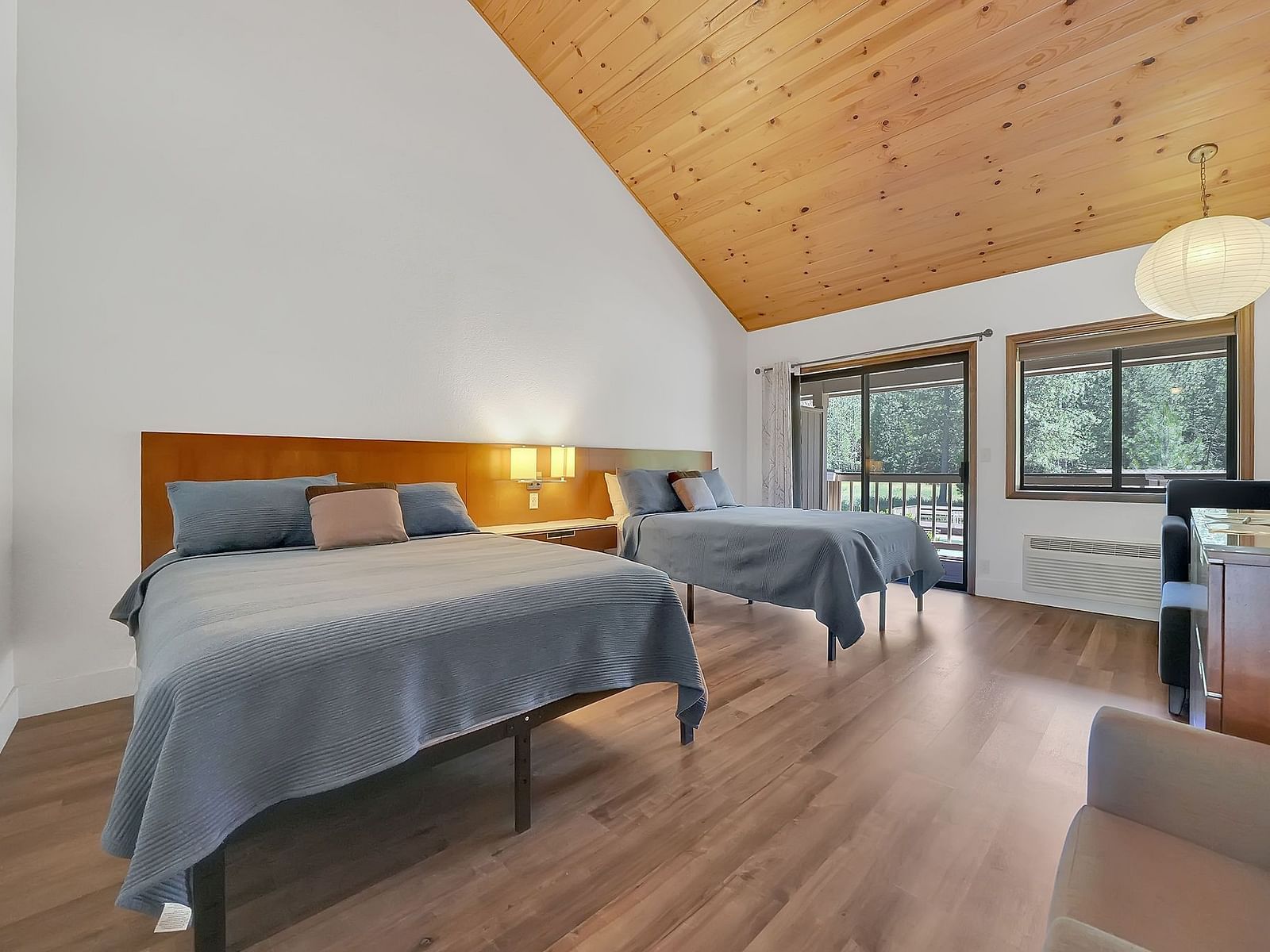 A view of a room at Amador Hotel with twin beds.