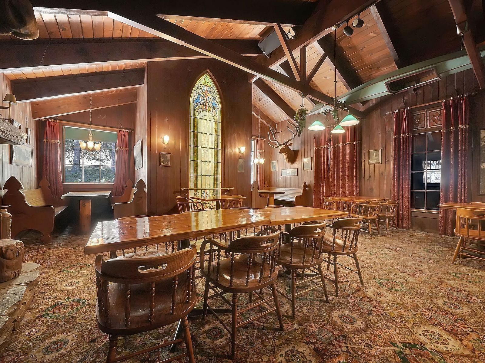 A view of a dining arrangement in a cabin with wooden interiors