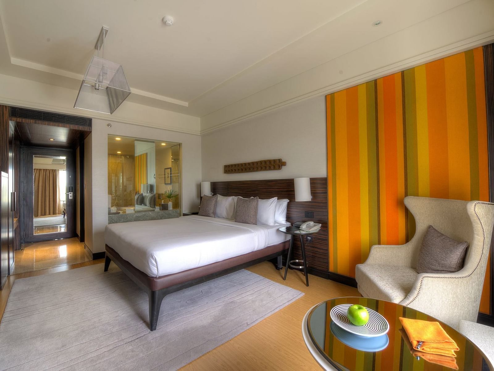 Image of Executive Suite at The Raintree St. Mary s Road with a bed and a sofa