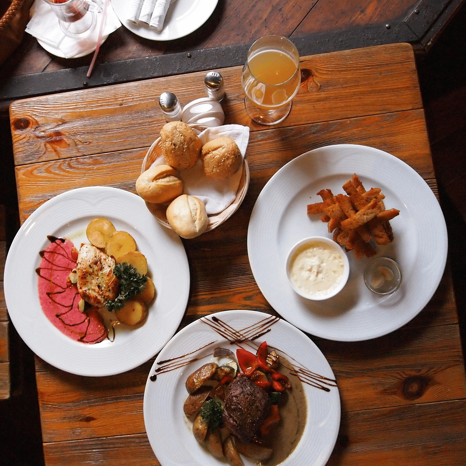 An aerial shot of multiple dishes placed on a wooden plate
