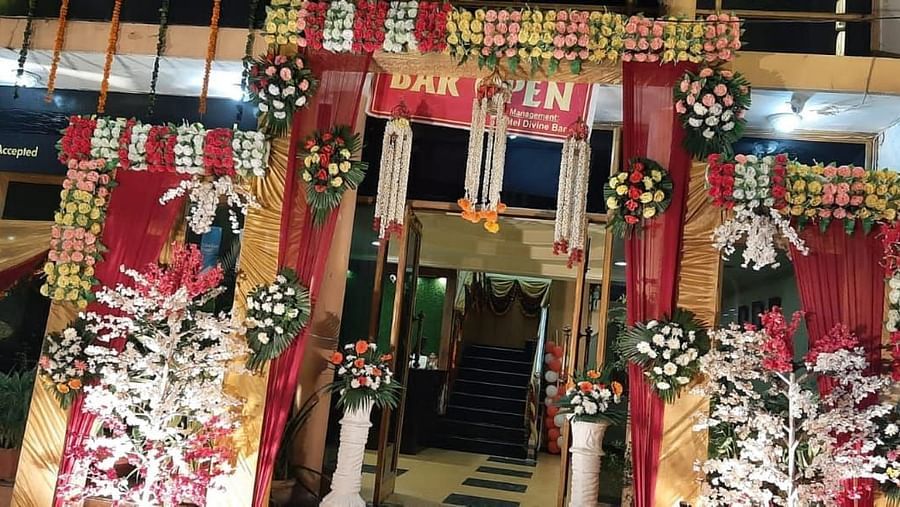 The entrance to our hotel in Roorkee with a signage reading that the bar is open - Motel Divine International, Roorkee