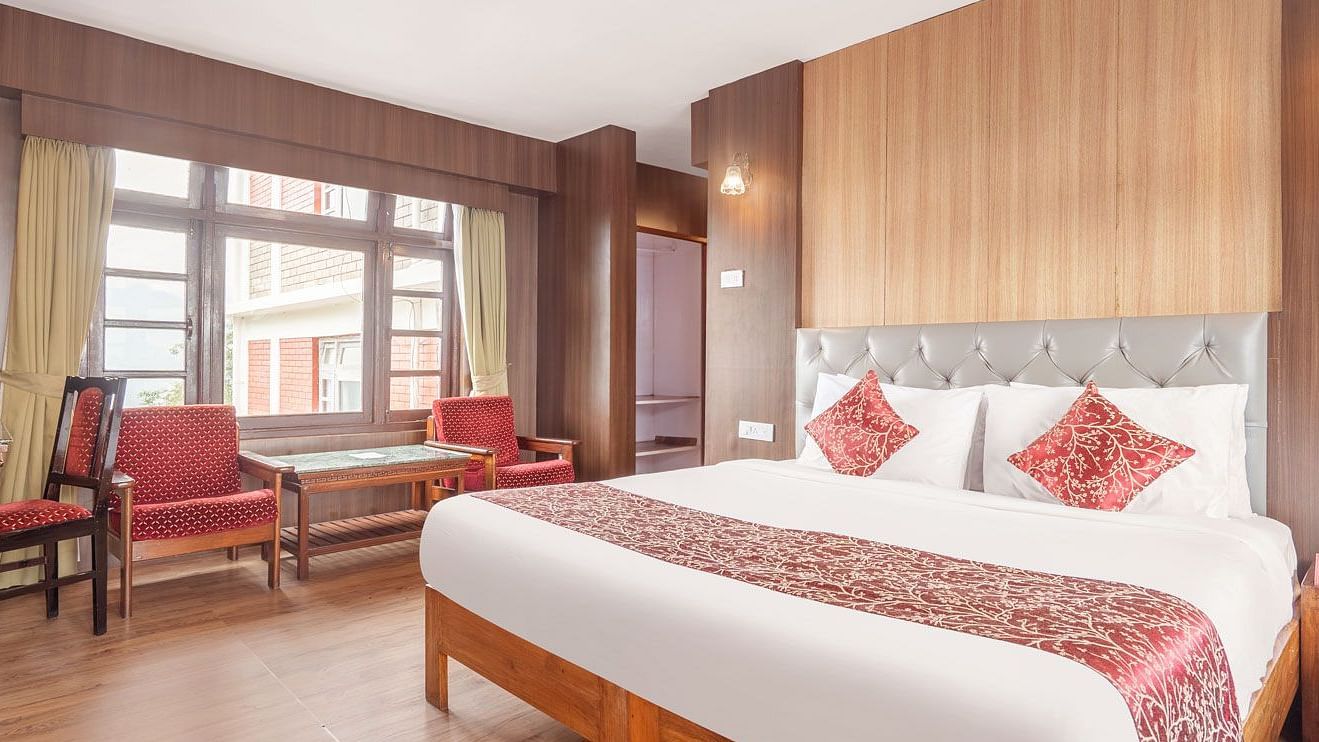 Image of a room with with double bed and sitting area at at Summit Tashi Ghang Heritage Resort, Pelling