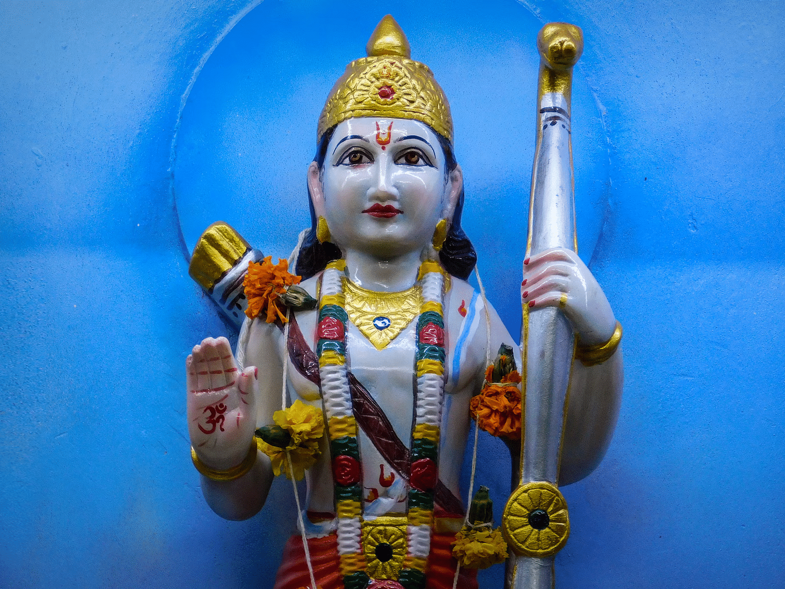 Close up image of Ram holding a bow and arrows
