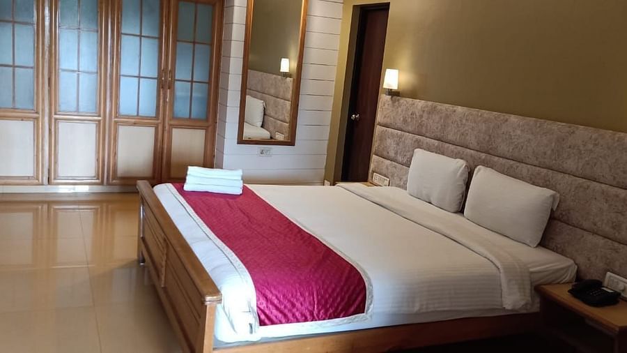 Damanganga Valley Resorts Pvt Ltd - the king size bed offered by the Executive Room