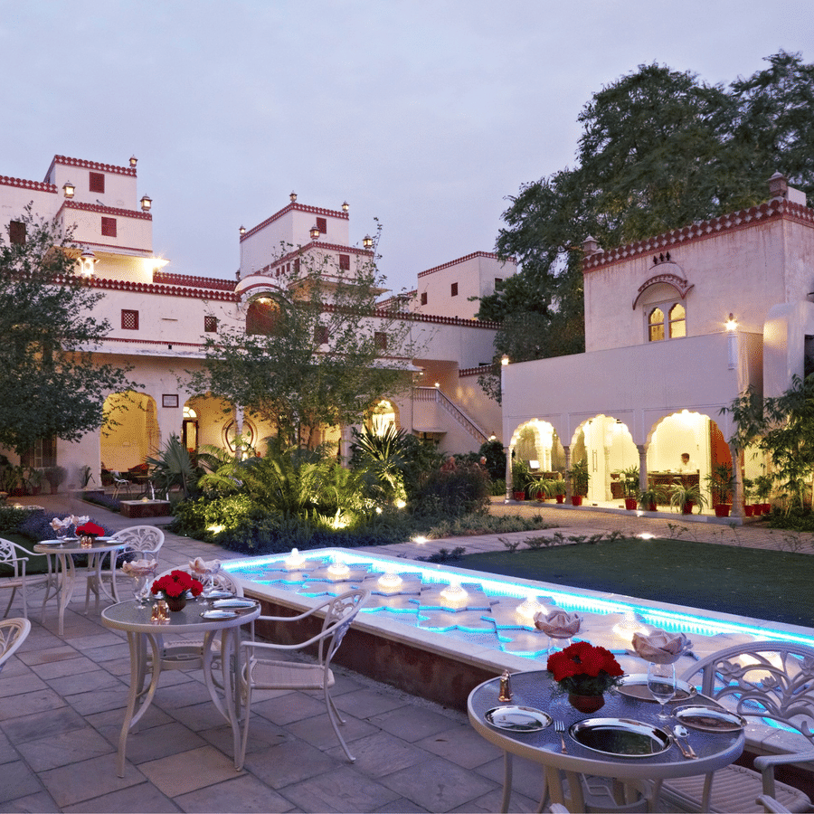 Seating arrangements in the courtyard next to the fountain at anada restaurant at Mandawa Haveli, Jaipur