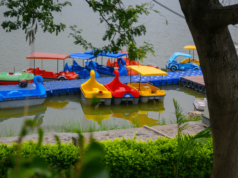 Colorful paddle boats docked at Sabarmati Riverfront for boating activities