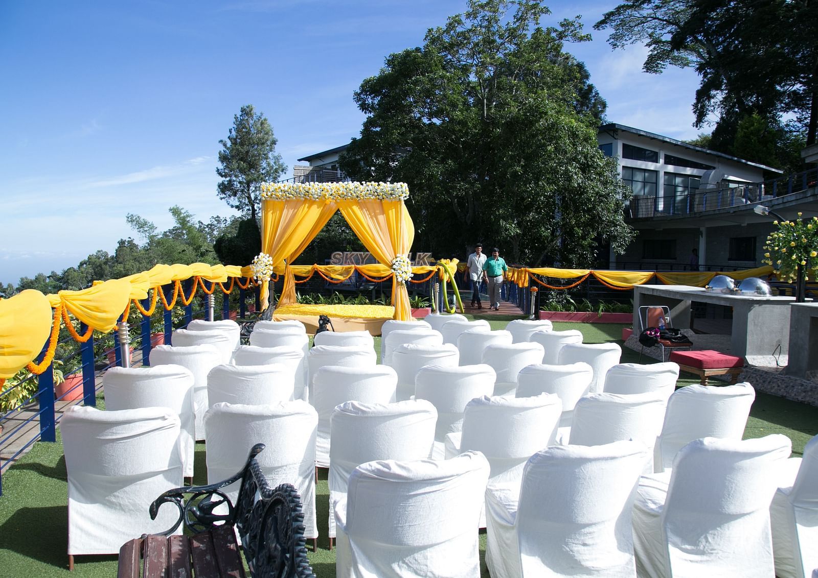 An image of the open banquet space with chairs and decoration - Great Trails Yercaud by GRT Hotels
