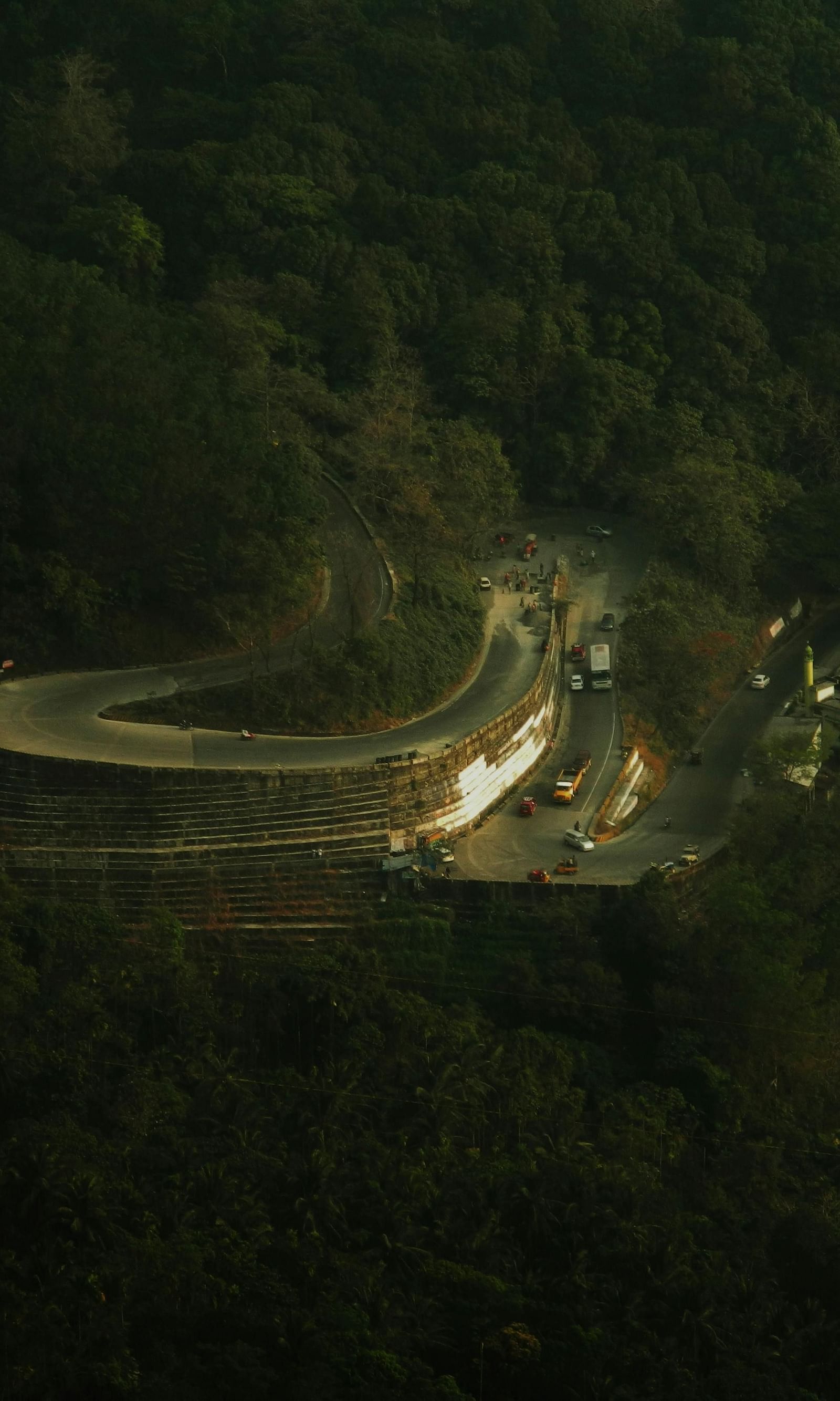 An image of a road in the shape of hairpin bend in Wayanad