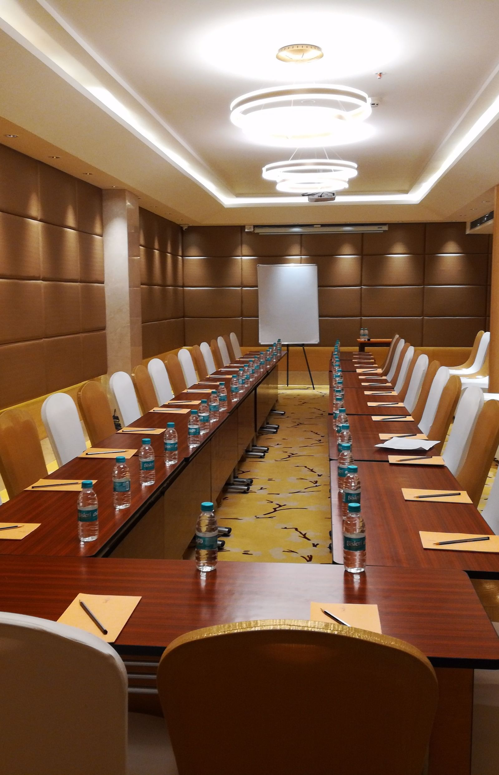 a meeting hall with a long rectangular table with chairs surrounding it - Hotel Fountain Tree By TGI - JP Nagar, Bangalore