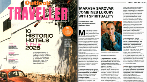 The image shows the Outlook Traveller cover and an article on Marasa Sarovar Premiere, highlighting its luxury, spirituality, and sustainability.