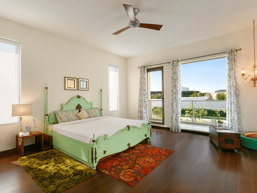 An overview of a bedroom inside Humming Bird Villa - Karma Lakelands.