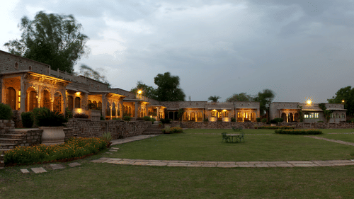 Deo Bagh - 17th Century, Gwalior - a panoramic view of the garden with the resort in Gwalior in the background during evening