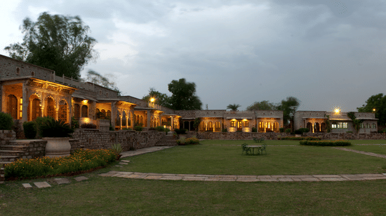 Deo Bagh - 17th Century, Gwalior - a panoramic view of the garden with the resort in Gwalior in the background during evening