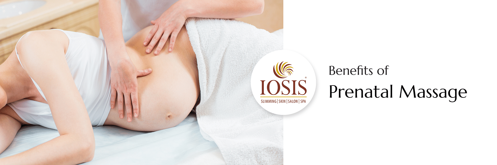 A pregnant lady lying on a spa bed in side position to get prenatal massage done