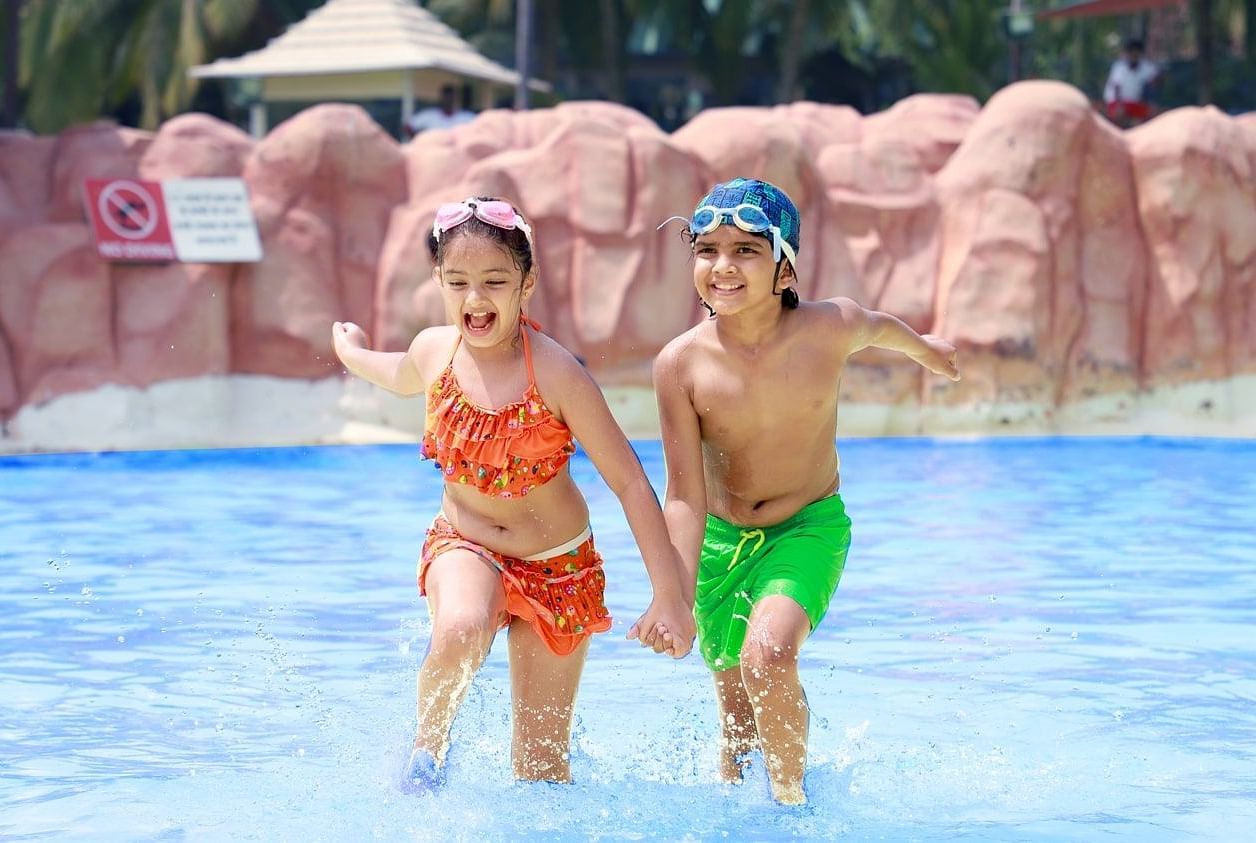 two children playing in a pool at Water Kingdom