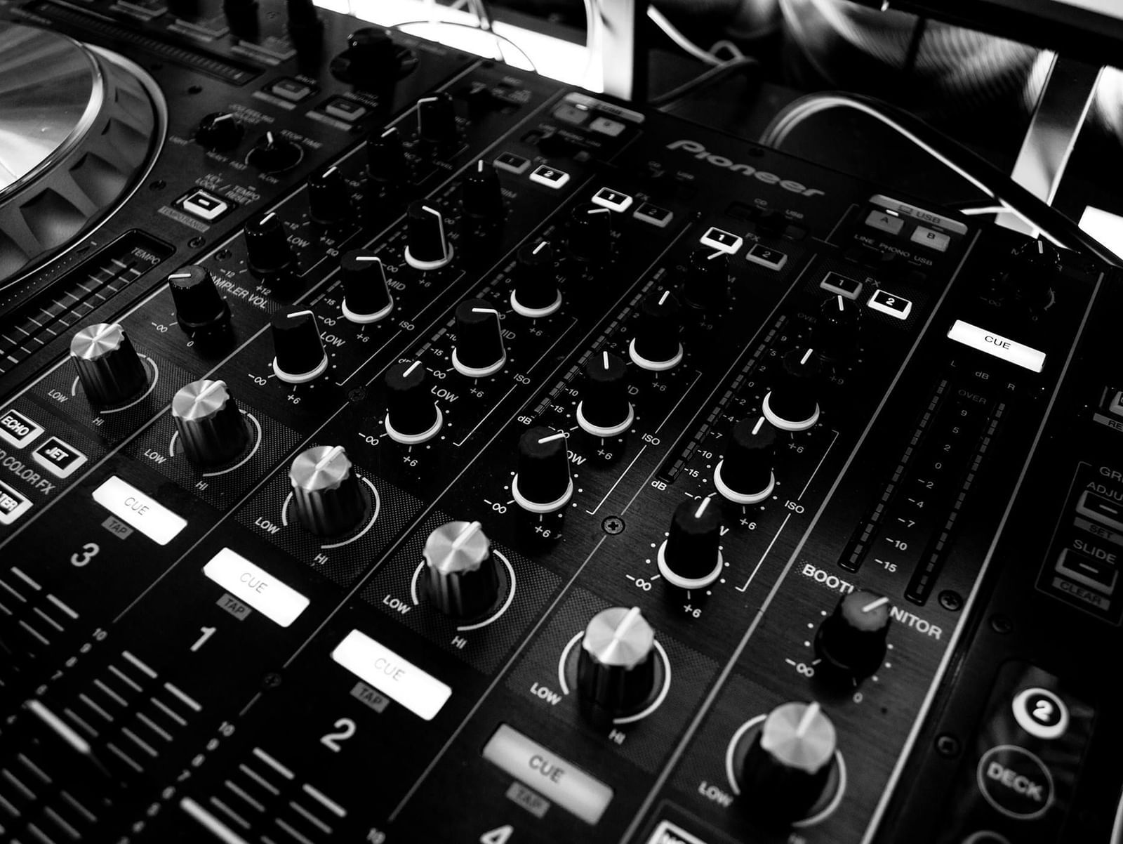 Close-up of a multi-button audio system console.