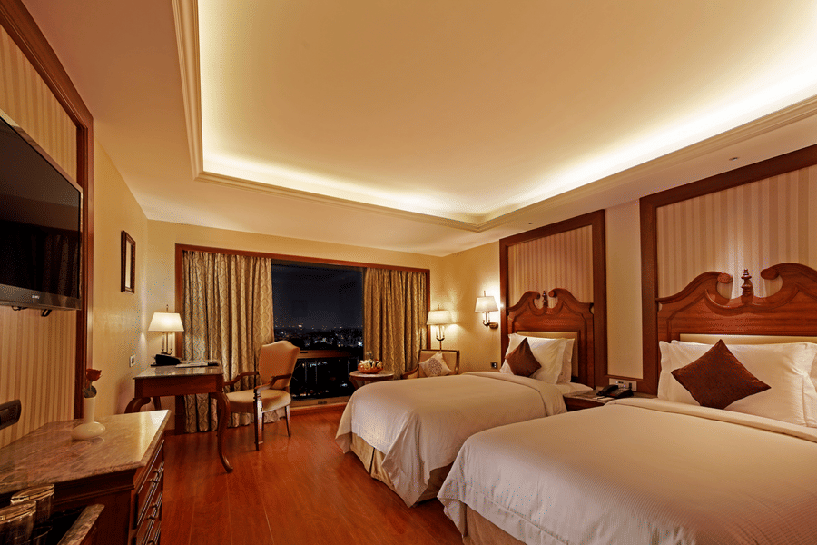 Spacious rooms with twin beds and windows overlooking the city at Hablis Hotel, Chennai