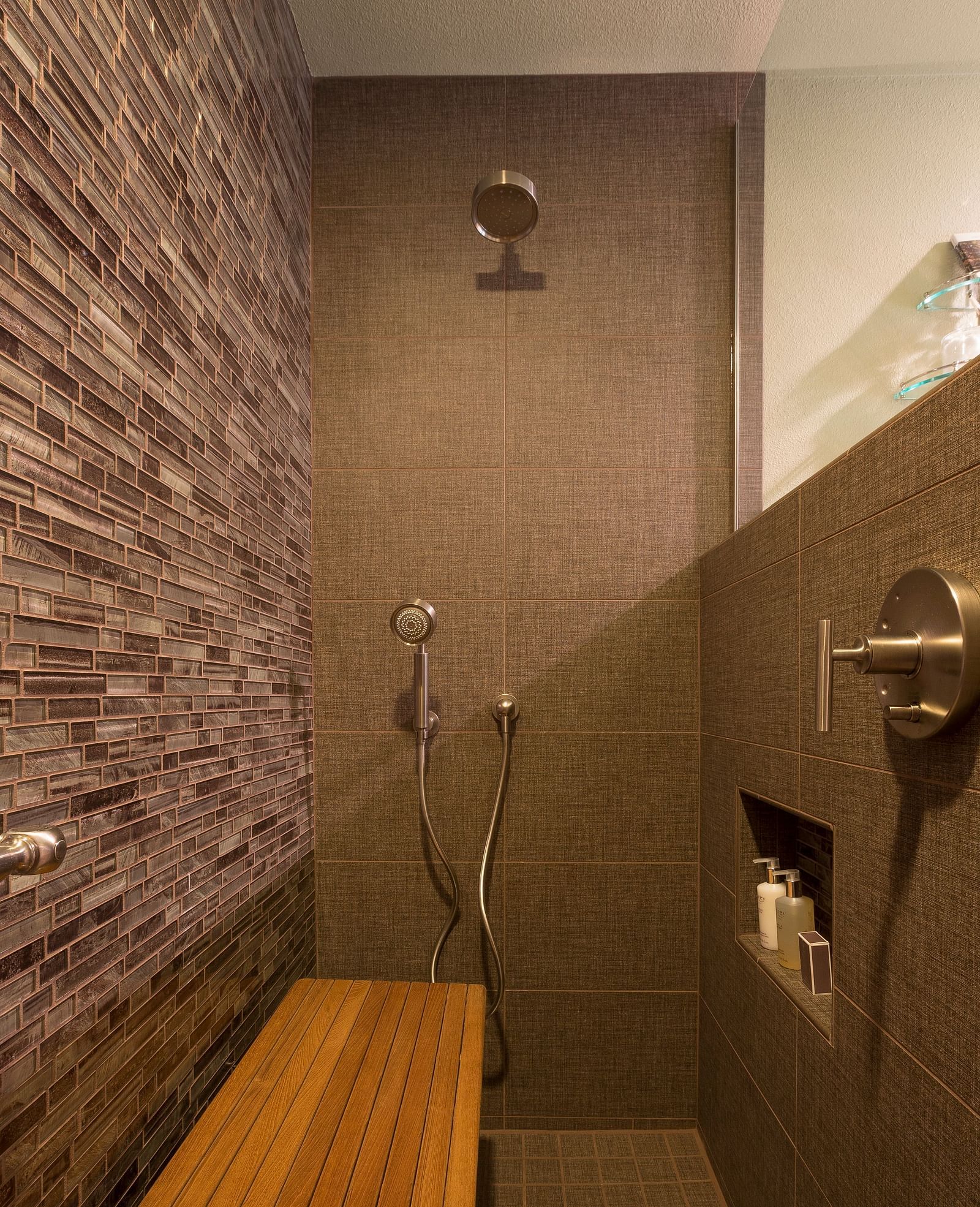 A shower area with wooden fixtures to sit on - Brewery Gulch Inn & Spa