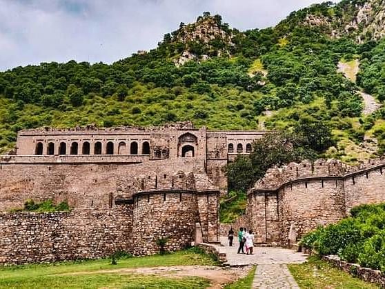 Bhangarh fort- a historic hilltop fortress, viewed from a distance.
