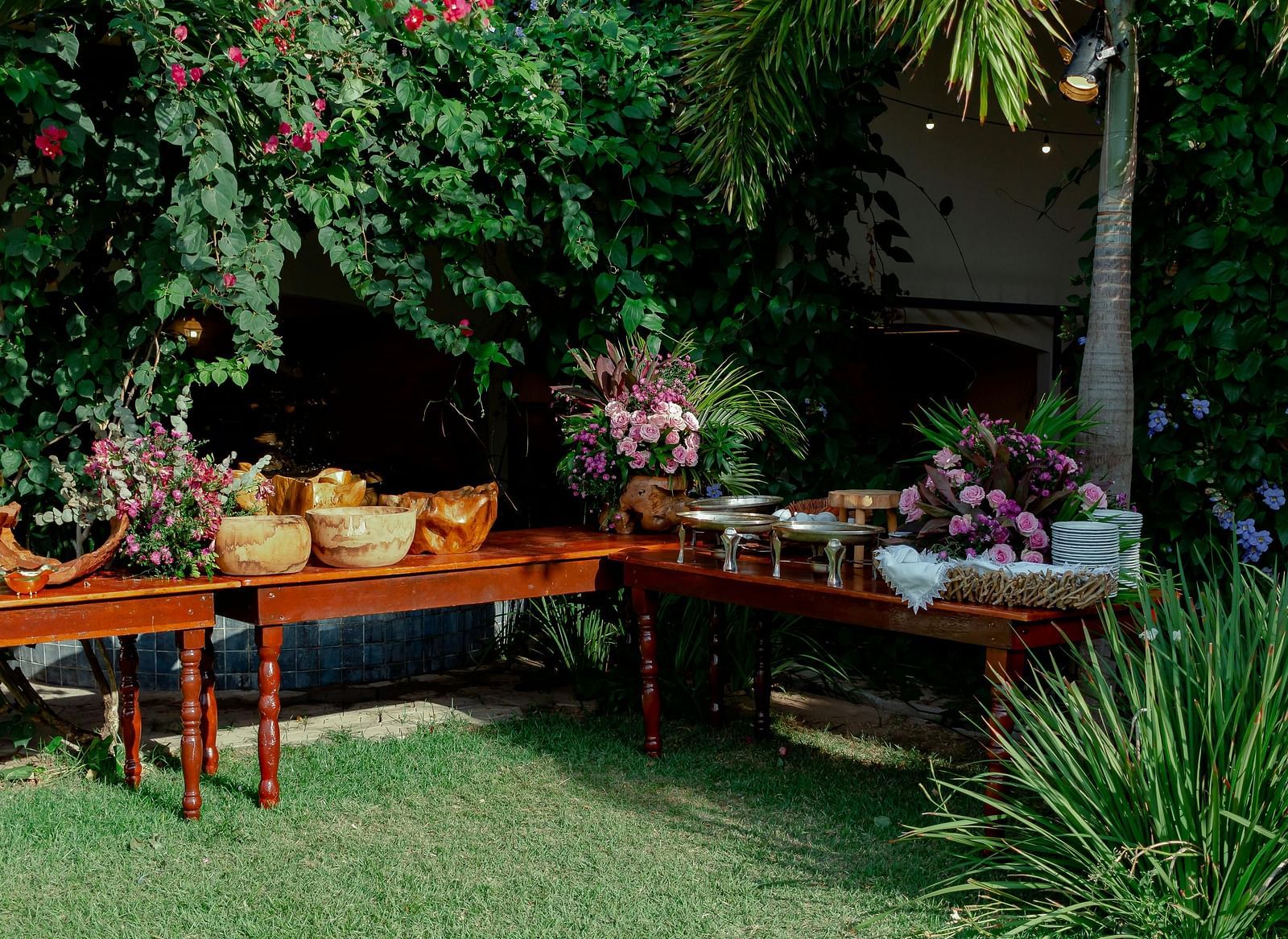 An outdoor dining arrangement in a garden during the day