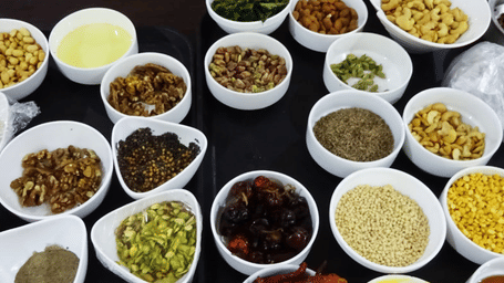 Multiple bowls filled with a variety of ingredients used for cooking.