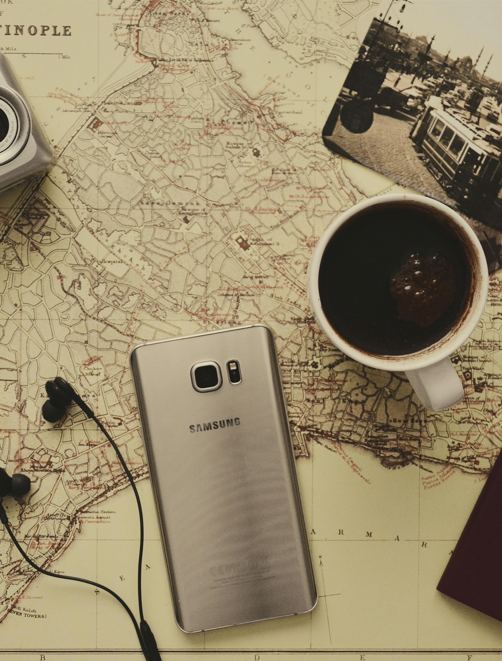 Shot of a map and mobile phone kept on the table.