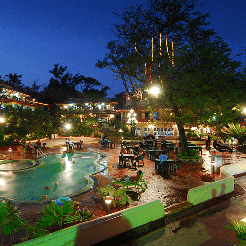 Adamo Matheran Resort - view of the pool along with the hotel in Matheran during evening