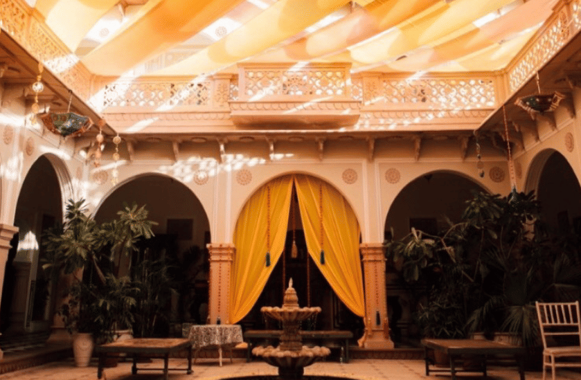 A vibrant canopy ceiling above a grand seating area, adding colour and charm to the ambience - Khas Bagh, Jaipur.