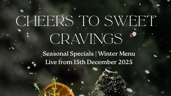 A winter-themed promotional poster of Cheers to Sweet Cravings showcasing festive hot beverages and desserts arranged among miniature snow-covered trees with seasonal specials highlighted.