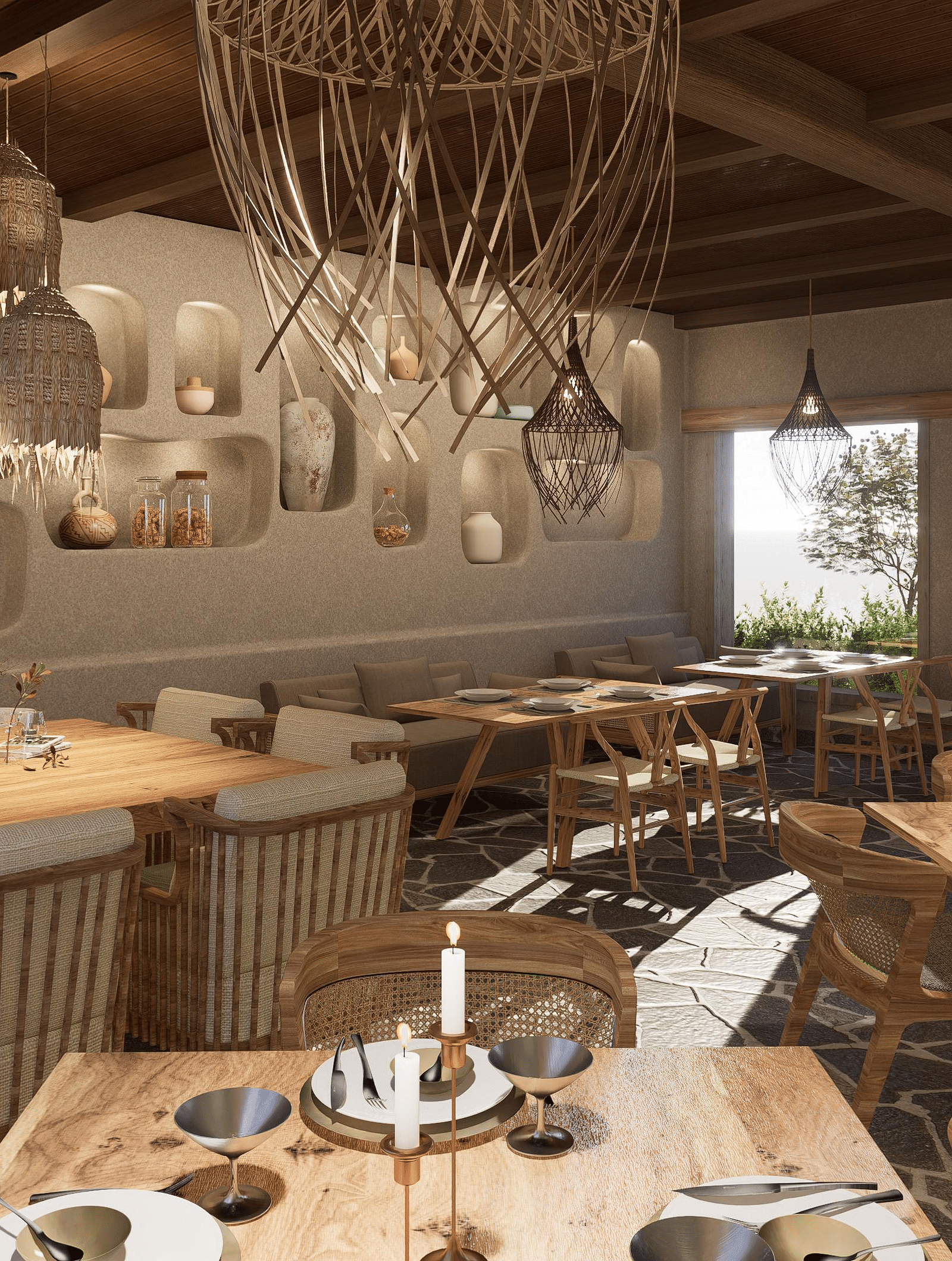 Dining area with tables and chairs set, and a chandelier hanging from the ceiling at The Evren, Vagator.