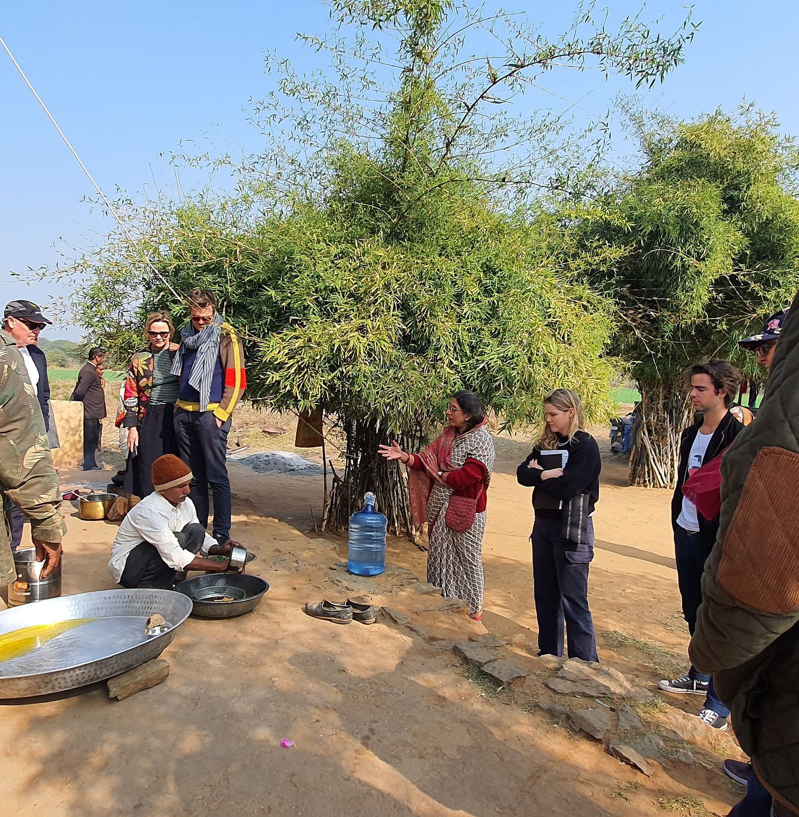 image of a group of tourists visiting a local school at dev shree, deogarh