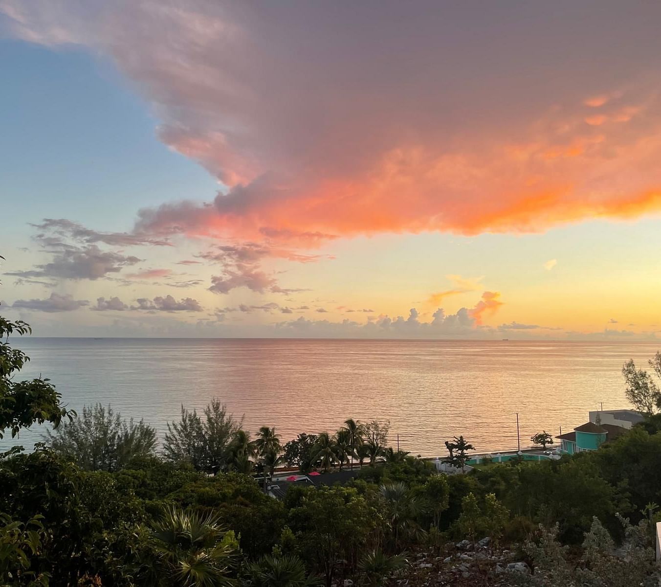Vibrant sunset with trees overlooking the ocean | A Stone's Throw Away