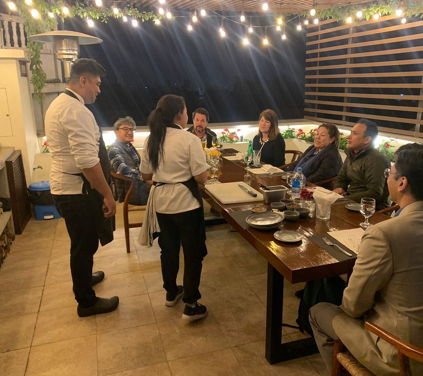 A group of people gathered for the chefs table dinner