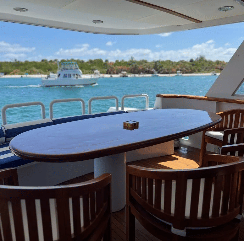 A dining area with an ashtray kept on the table overlooking the serene views of the sea and the island from the Dreamcatcher.