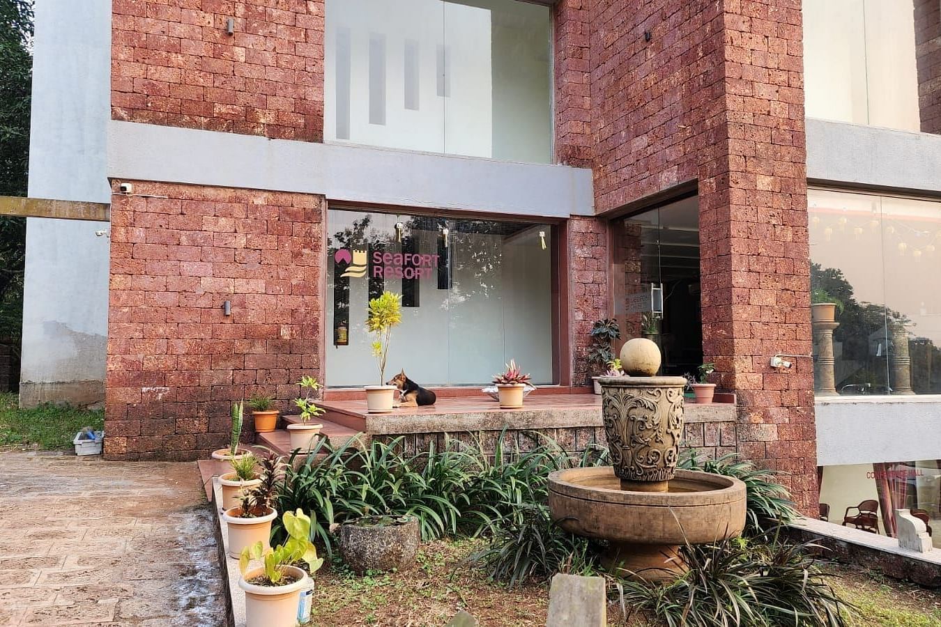 The entrance of the resort with antique pots placed on the side as decoration at SeaFort Beach Resort