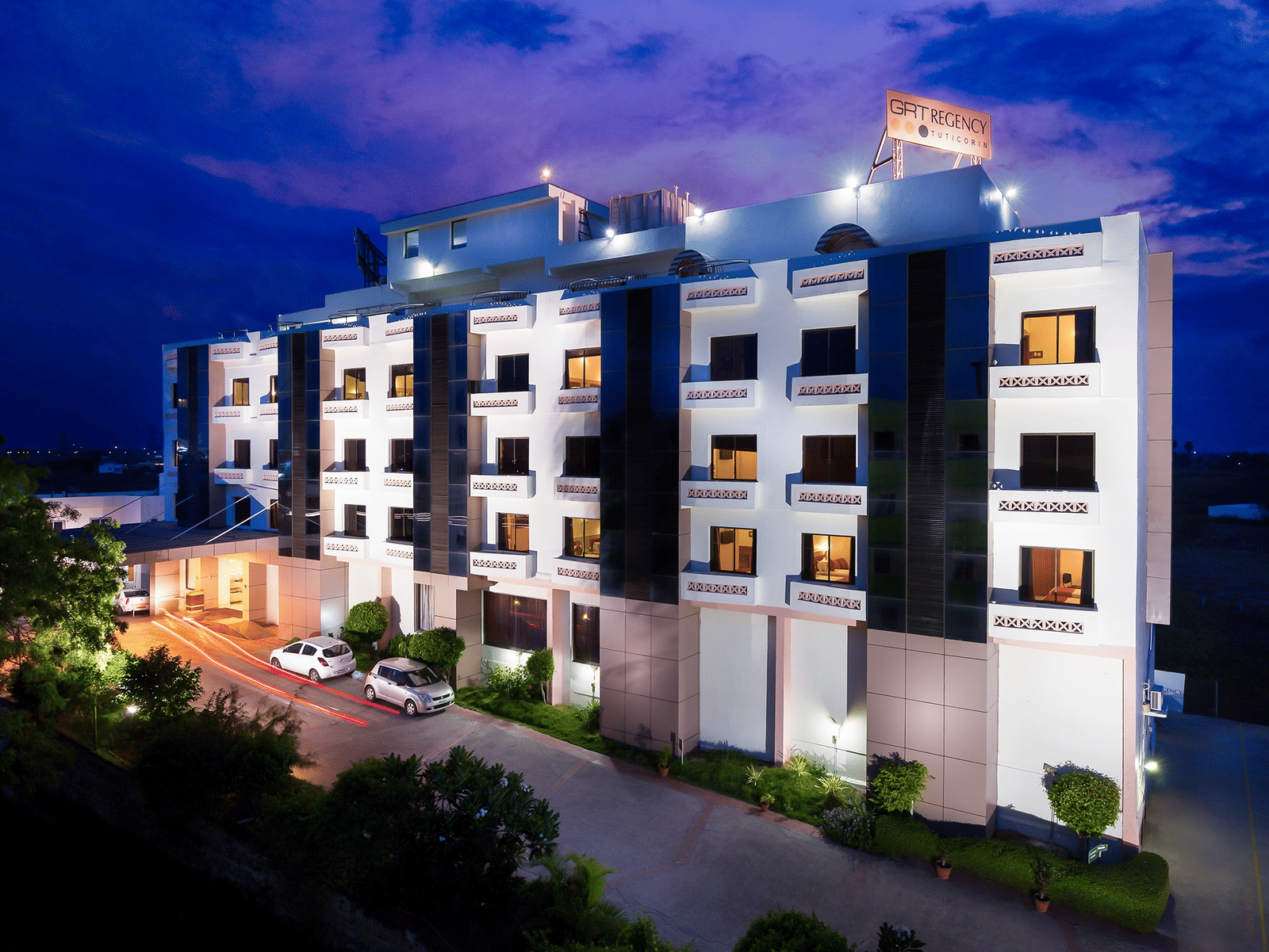 The exterior facade of a hotel building illuminated by warm lights - Regency Tuticorin by GRT Hotels, Best Hotel in Tuticorin