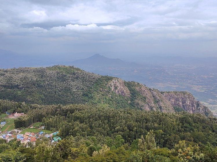A mountain range with misty sky in the background viewd from the Pagoda Point in Yercaud.