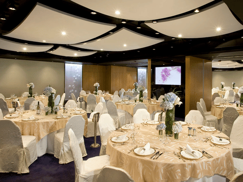 Dining arrangement at the banquet hall on a round table seating - Symphony Summer Sand Beach Resort And Spa, Neil island