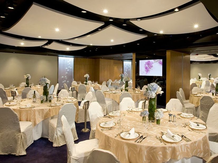 Dining arrangement at the banquet hall on a round table seating - Symphony Summer Sand Beach Resort And Spa, Neil island