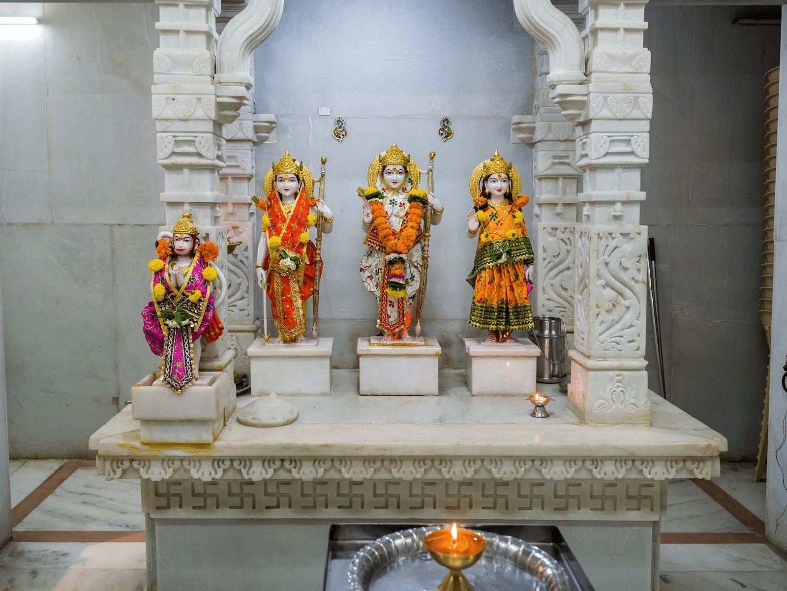 Image of Ganesha, Ram, Laxman and Sita statues in a holy place