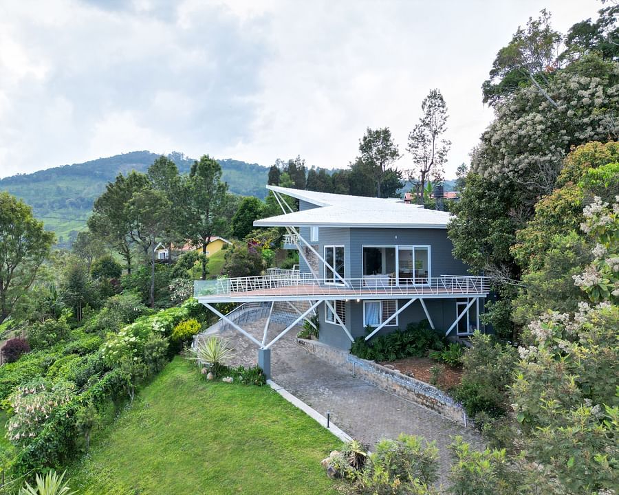 Contemporary resort surrounded by lush greenery and a well-kept lawn at Ibex Resort, Coonoor (Tapas).