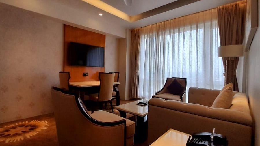a view of the living room with comfortable sofas and TV of C-Suite at Wonder country club resort