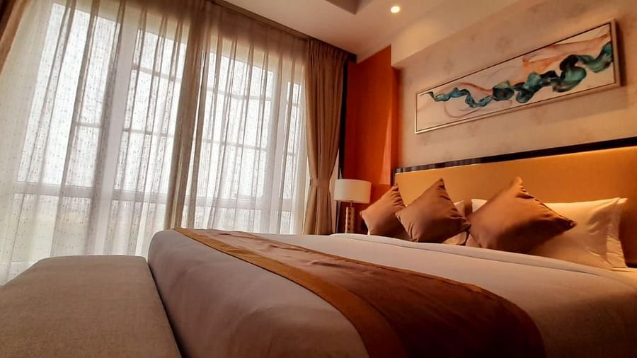 a view of a king bed of C-Suite at Wonder country club resort